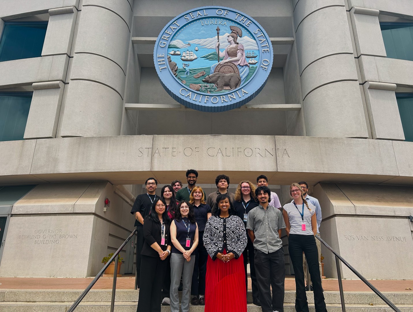 CPUC Executive Director Leuwam Tesfai with 2026 interns outside San Francisco office 