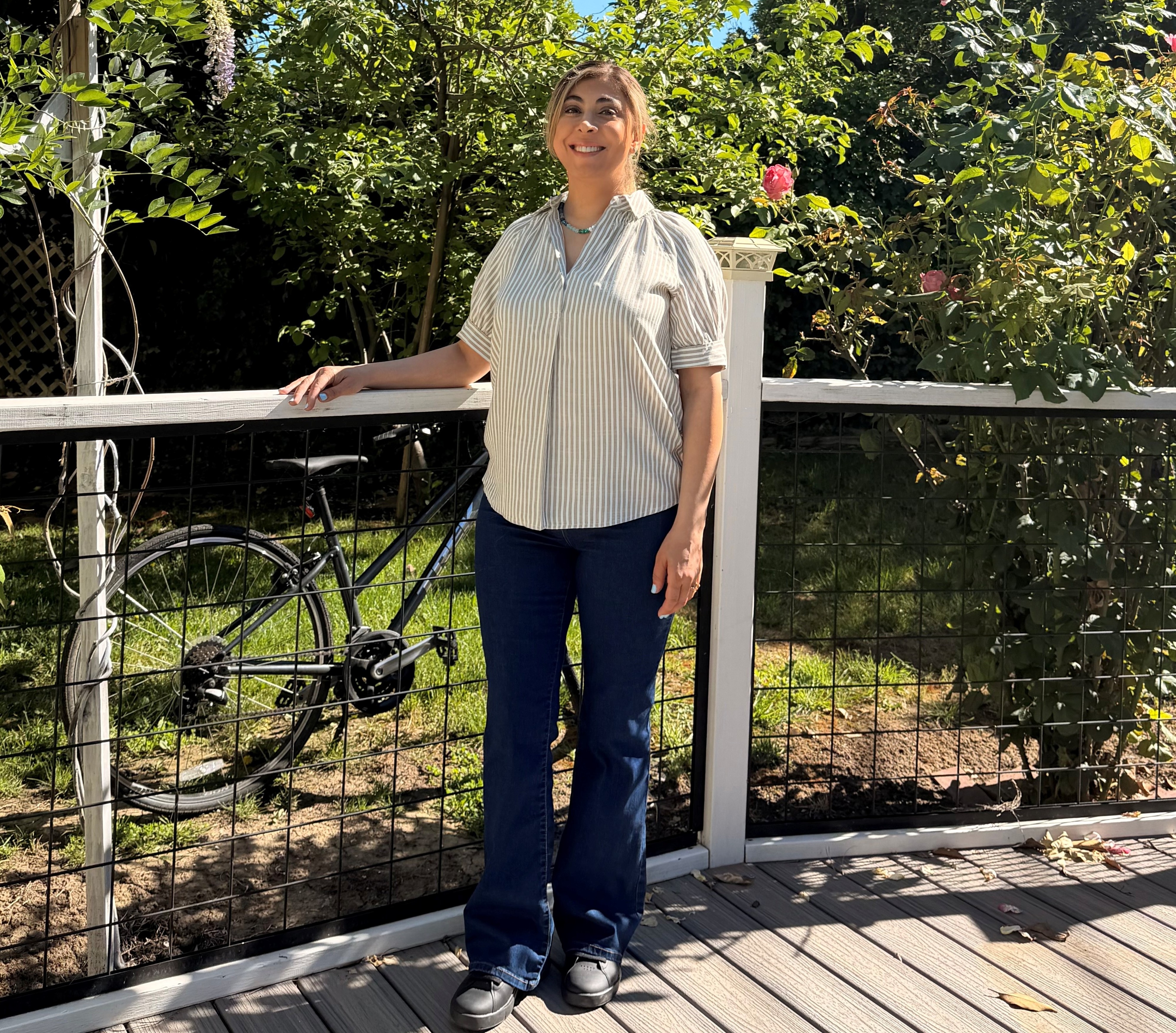 Sahba standing next to her bike outside