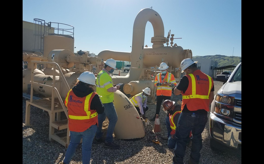 GSRB staff taking cathodic protection pipe-to-soil readings at a compressor station.
