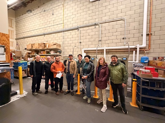 CPUC staff pose in the 'back of house" in a grocery store. 