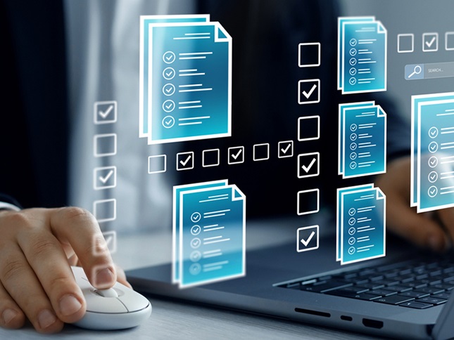 A man's hand and laptop keyboard are visible. There are document icons floating in space before him.