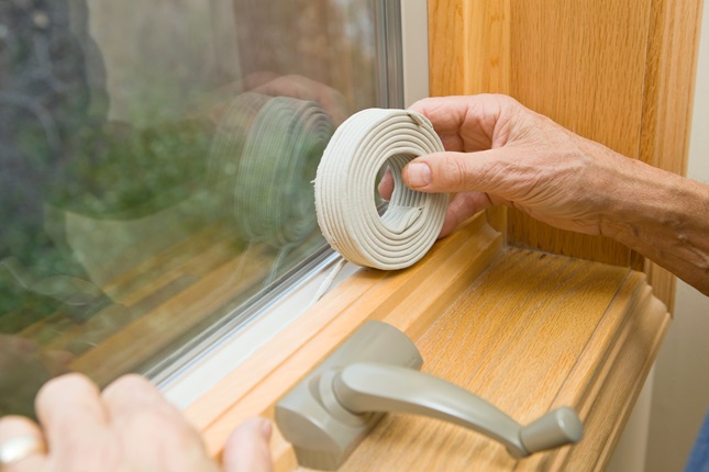 A person fixing window isolation